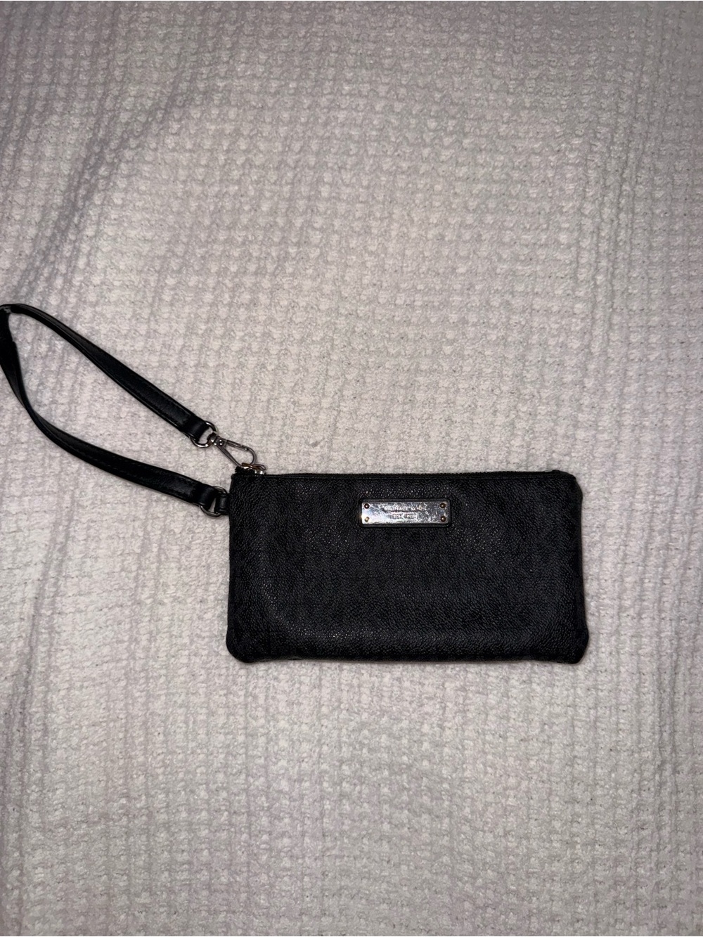 Michael Kors black wristlet clutch with logo plate